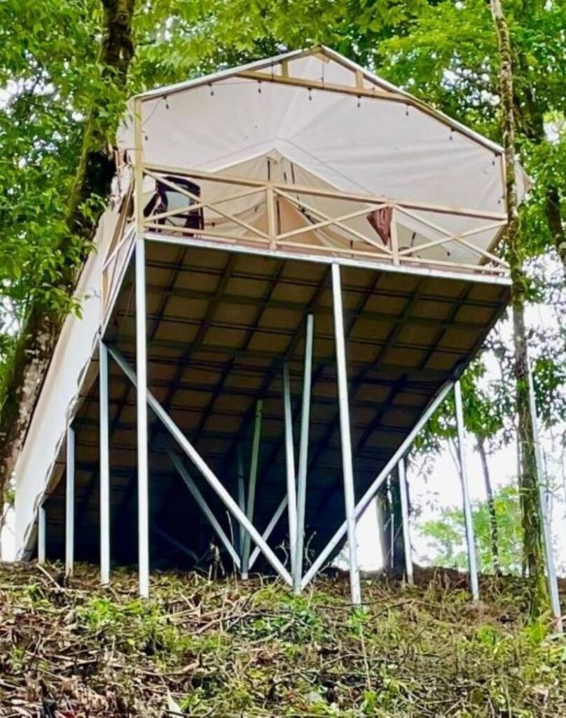 Río Celeste's Best Lodging, Volcano Tenorio Glamping Ranch Glamping tent on stilts with balcony overlooking Volcano Tenorio, Río Celeste community